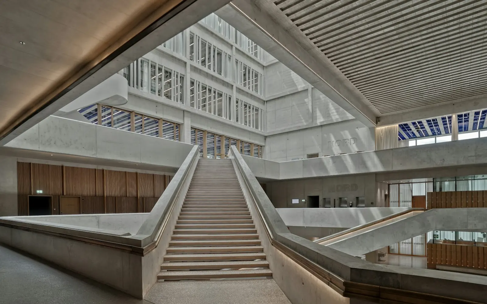 A bright modern library atrium with gallery floors